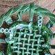 Antique woven basket in green glazed ceramic, fish decoration