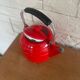 Old red enameled kettle