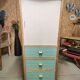 Asymmetrical compass foot cabinet