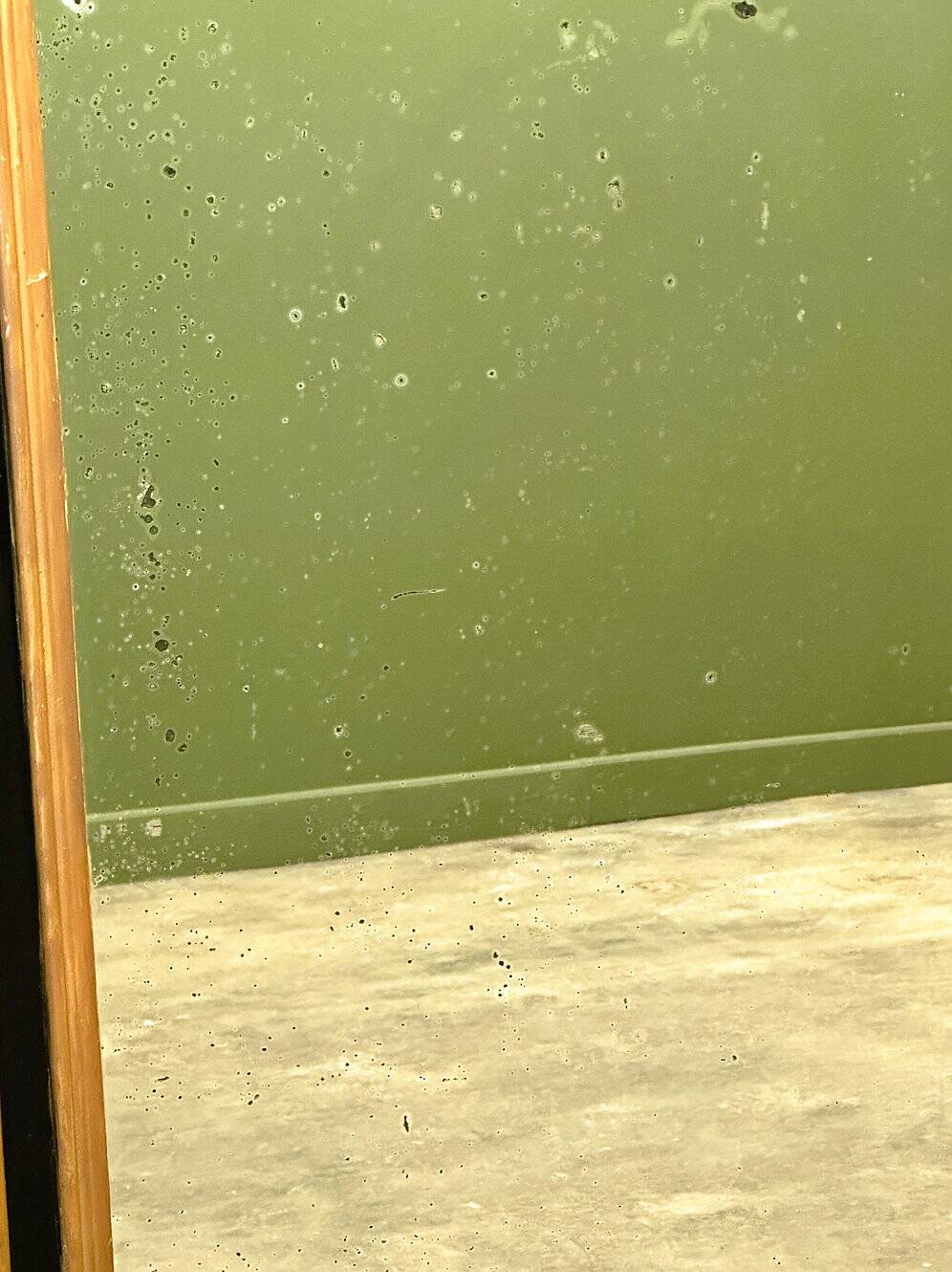 Antique 1800s black and gold mirror with cupid, France 1800s.