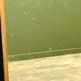 Antique 1800s black and gold mirror with cupid, France 1800s.