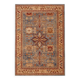 Oriental rug in beige, blue, and red wool.