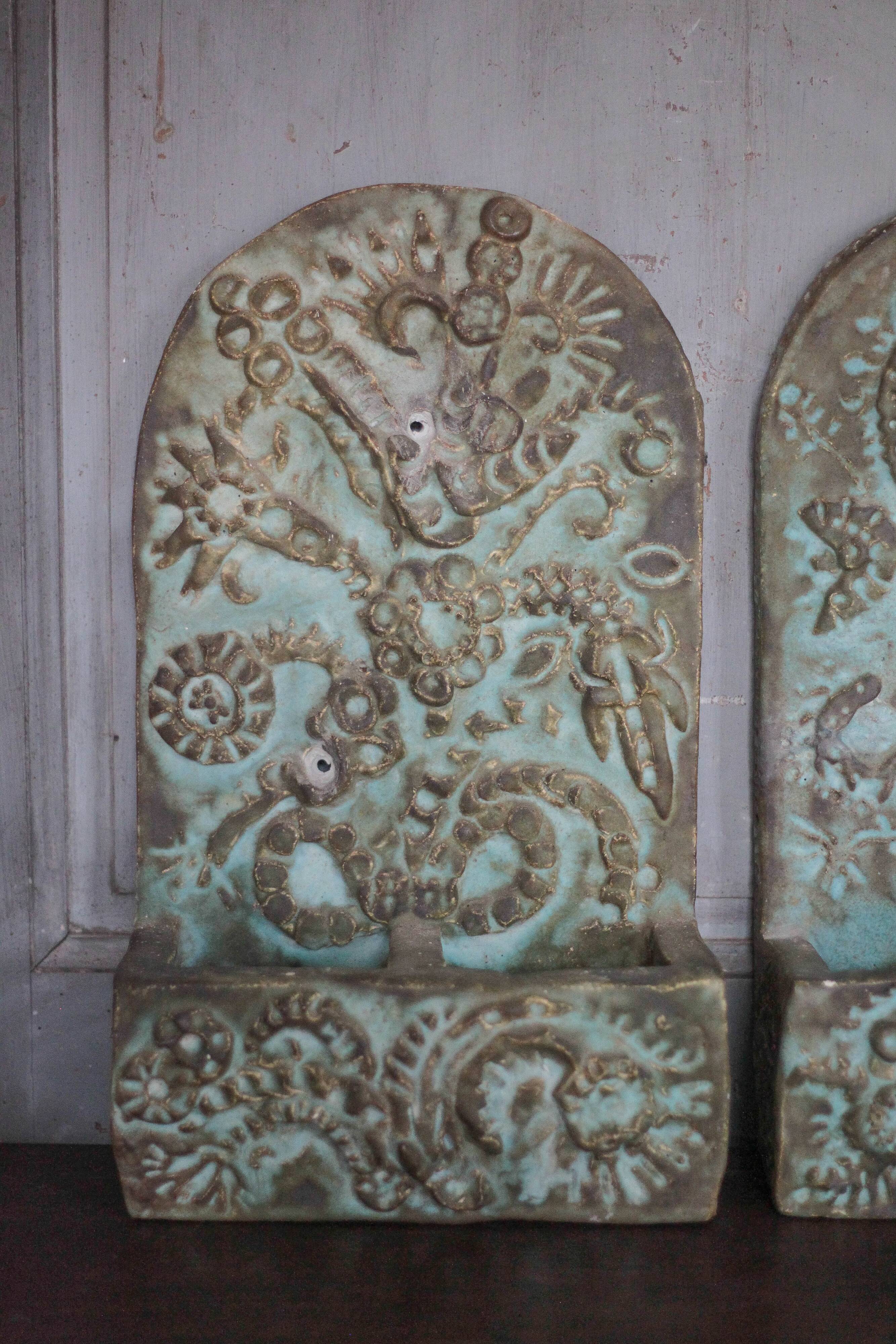 Pair of signed ceramic wall planters, pot cover