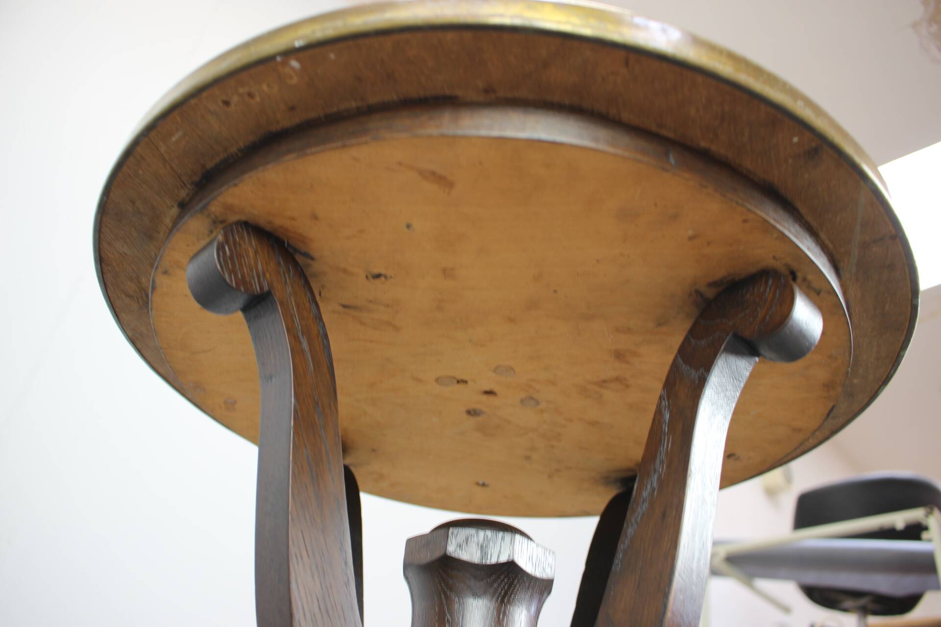 Art Deco chess table from the 1930s with a hand-decorated brass top and a stained oak base.