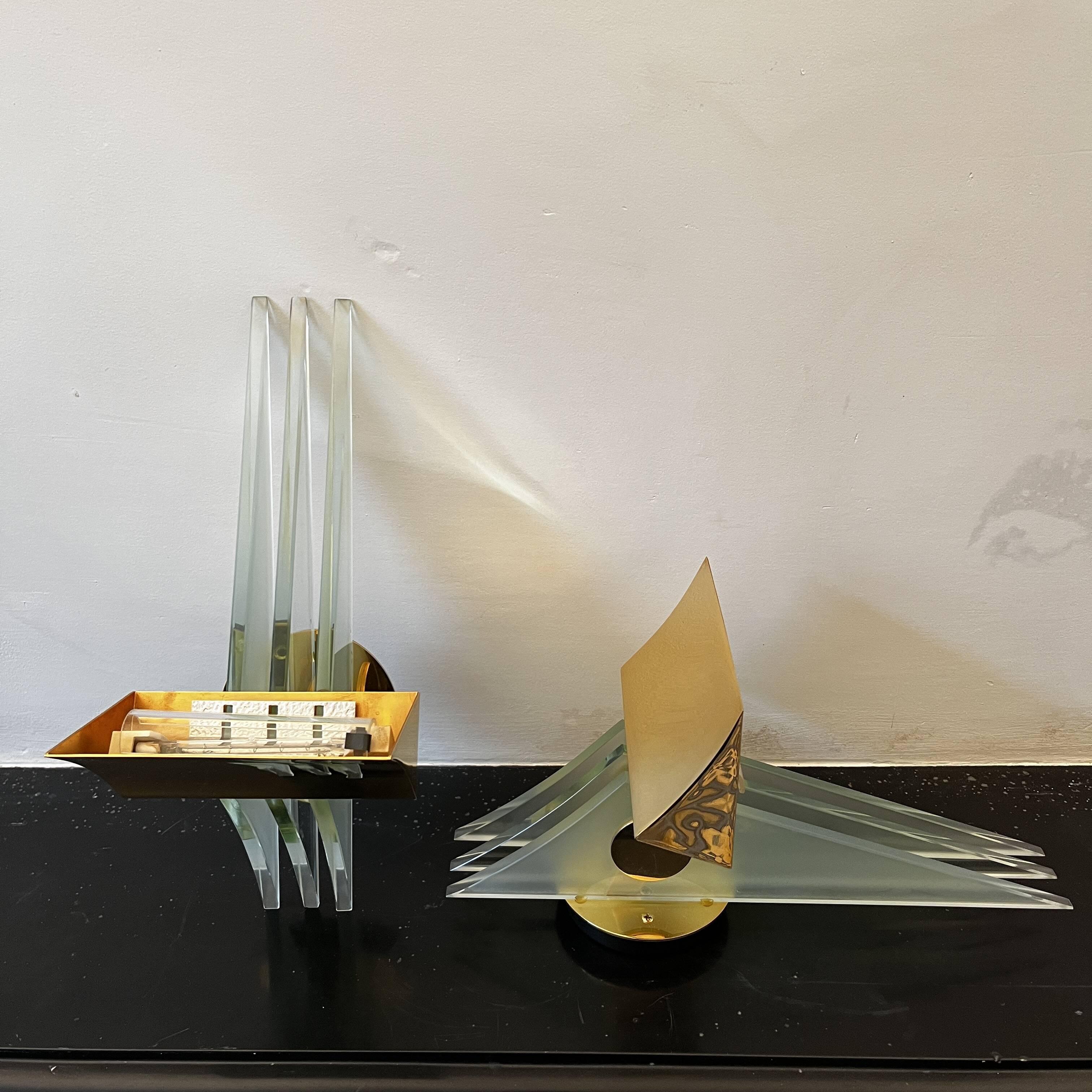 Pair of Hollywood Regency wall lights, bases & reflectors in gilded brass