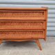 Commode vintage pied compas et rotin