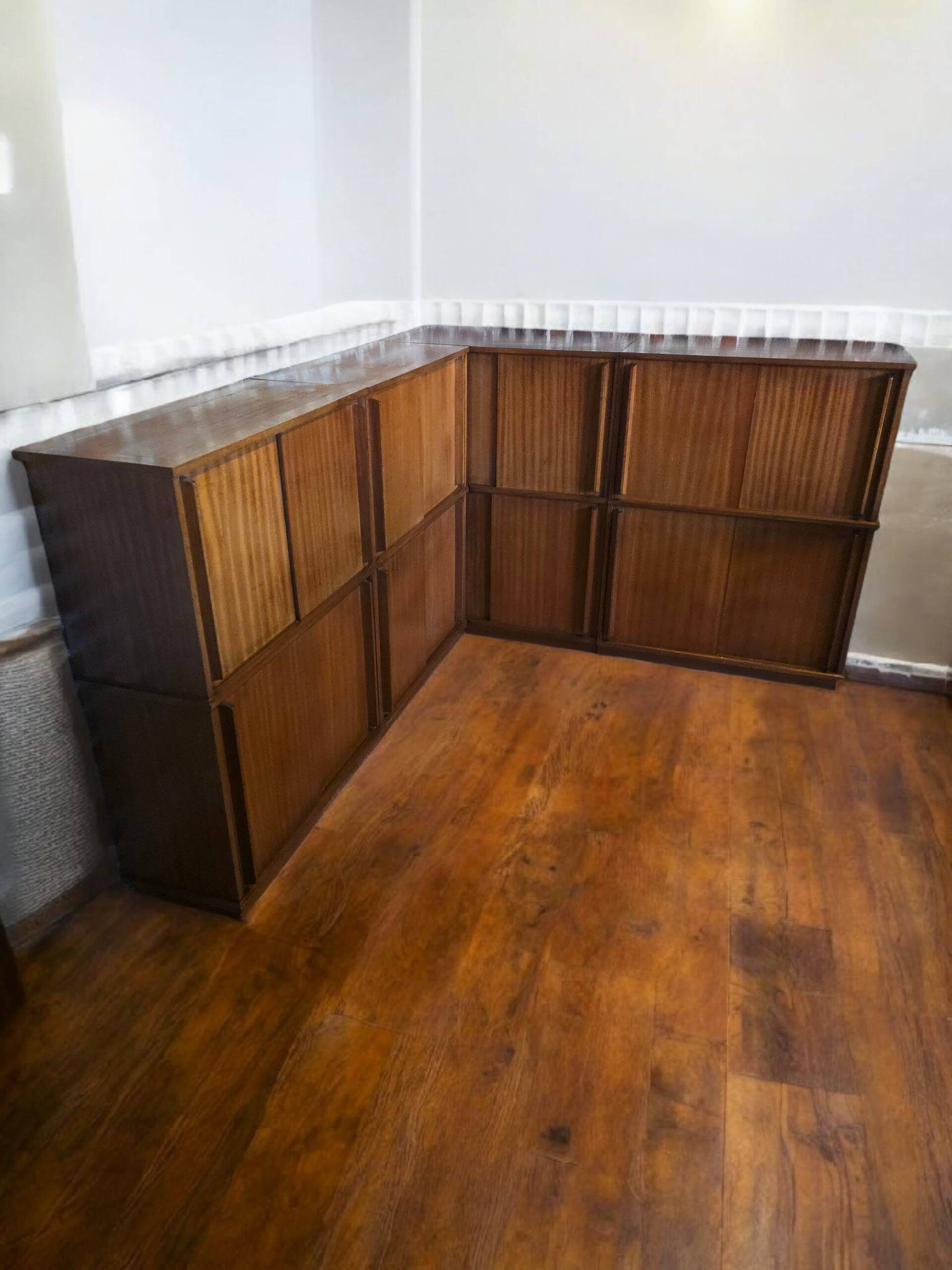 Modular corner library Oscar from the 1960s with sliding doors.