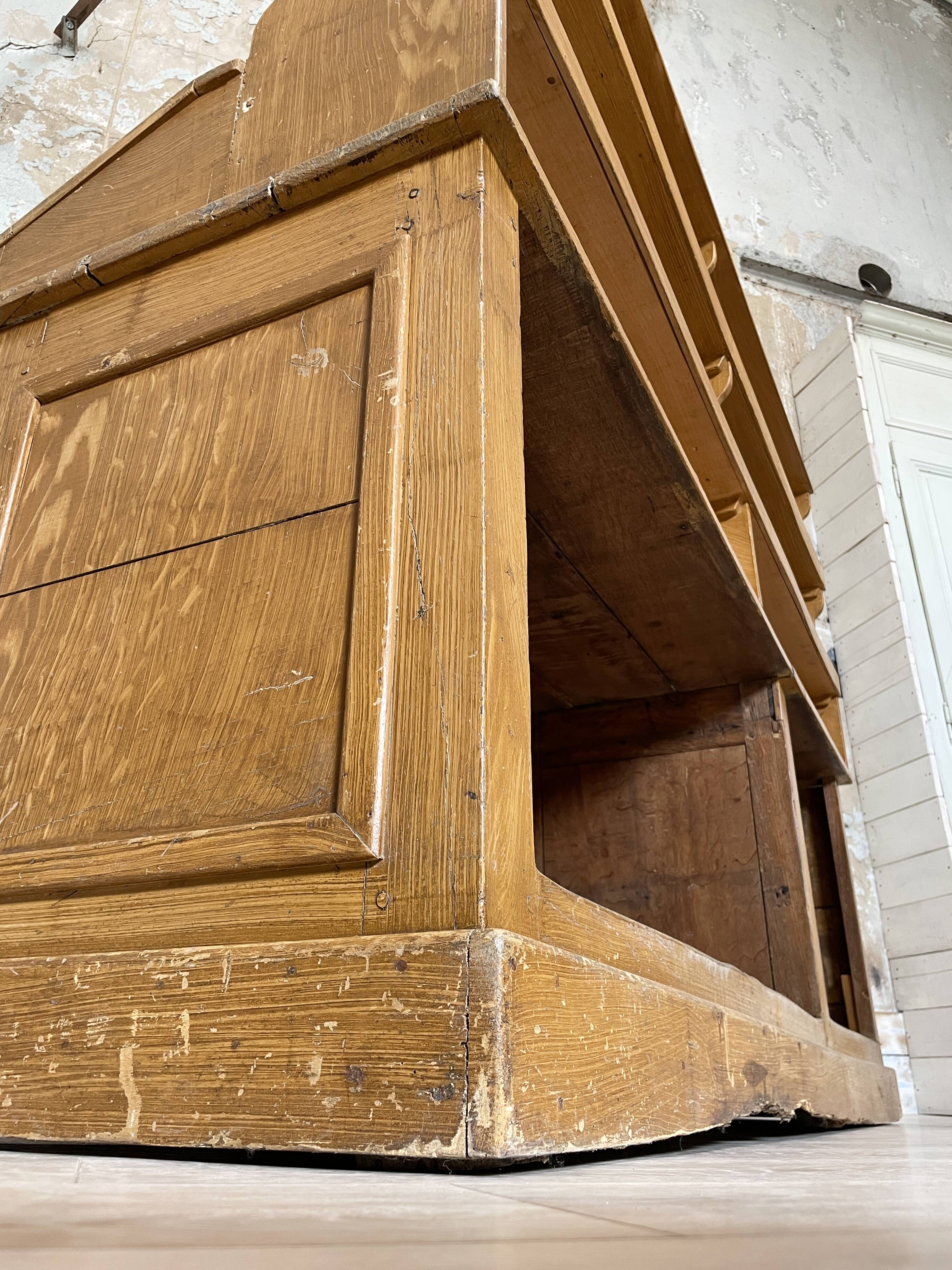 Wooden hardware cabinet painted with wood effect, circa 1940.