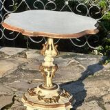 Carved and lacquered wooden side table.
