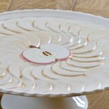 Large vintage earthenware pie dish on a pedestal, apple pie