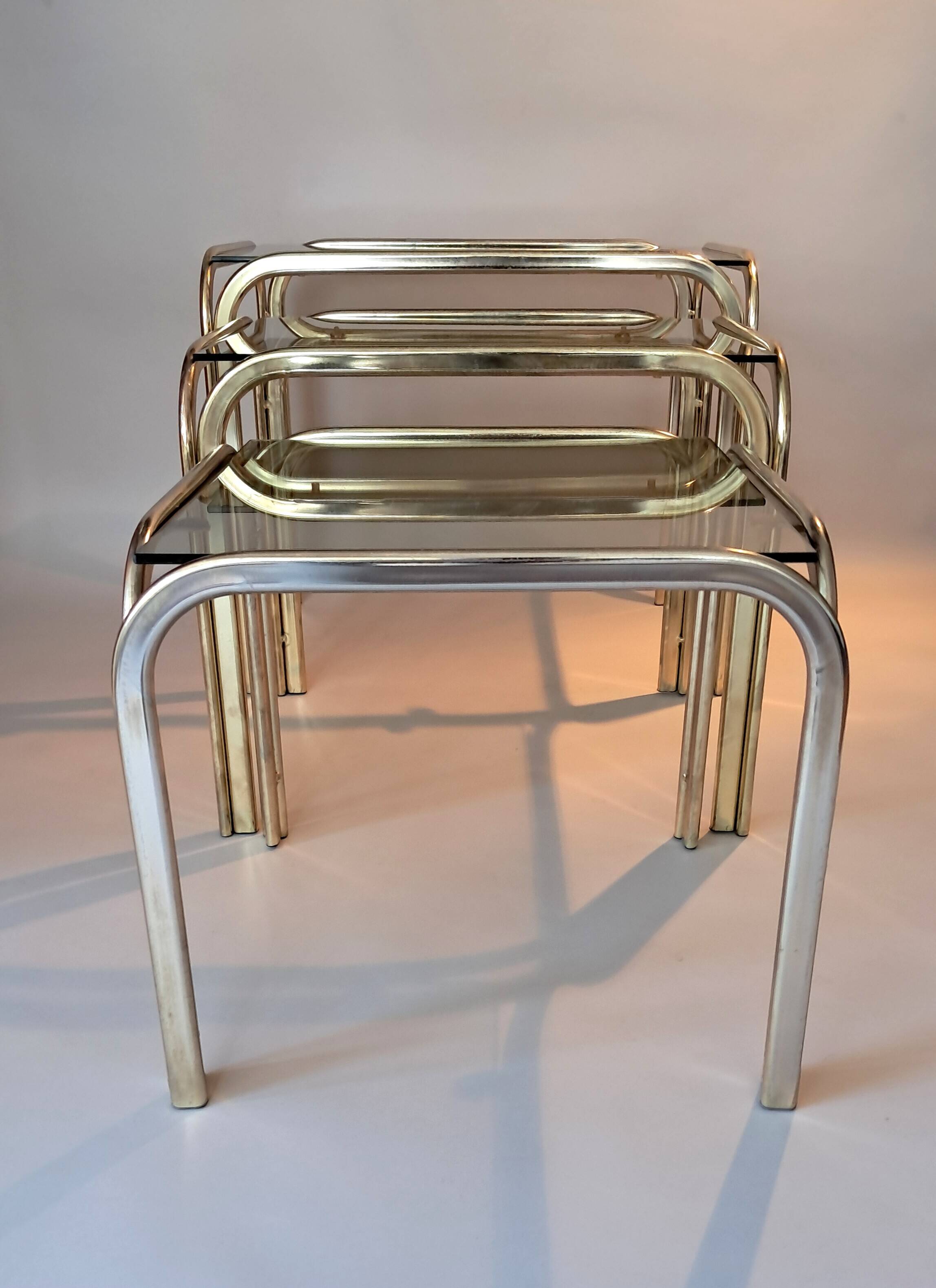 3 vintage golden nesting tables with smoked glass.