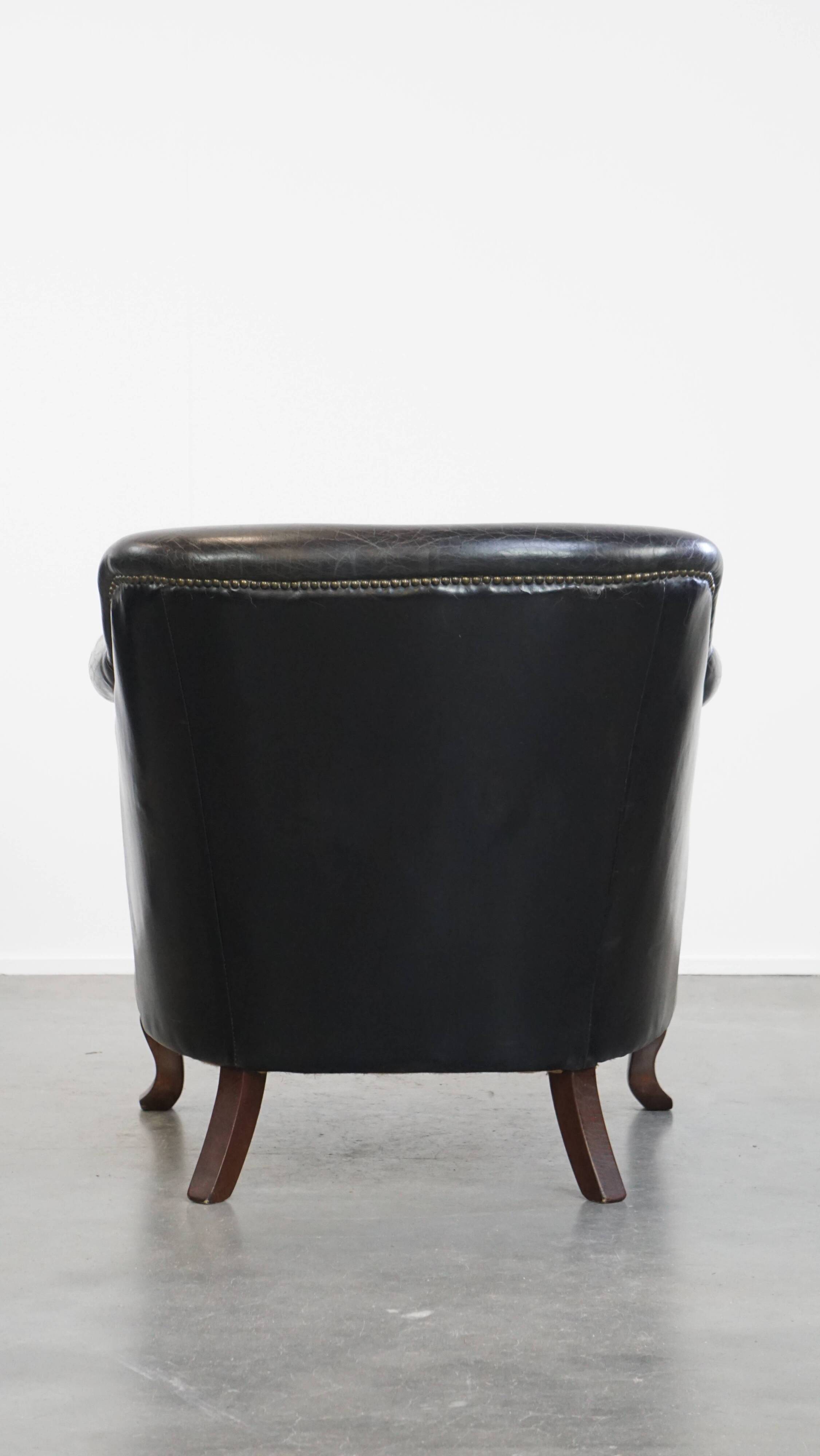 Black grained cowhide leather armchair