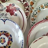 Set of 8 ironstone plates with coordinated designs.