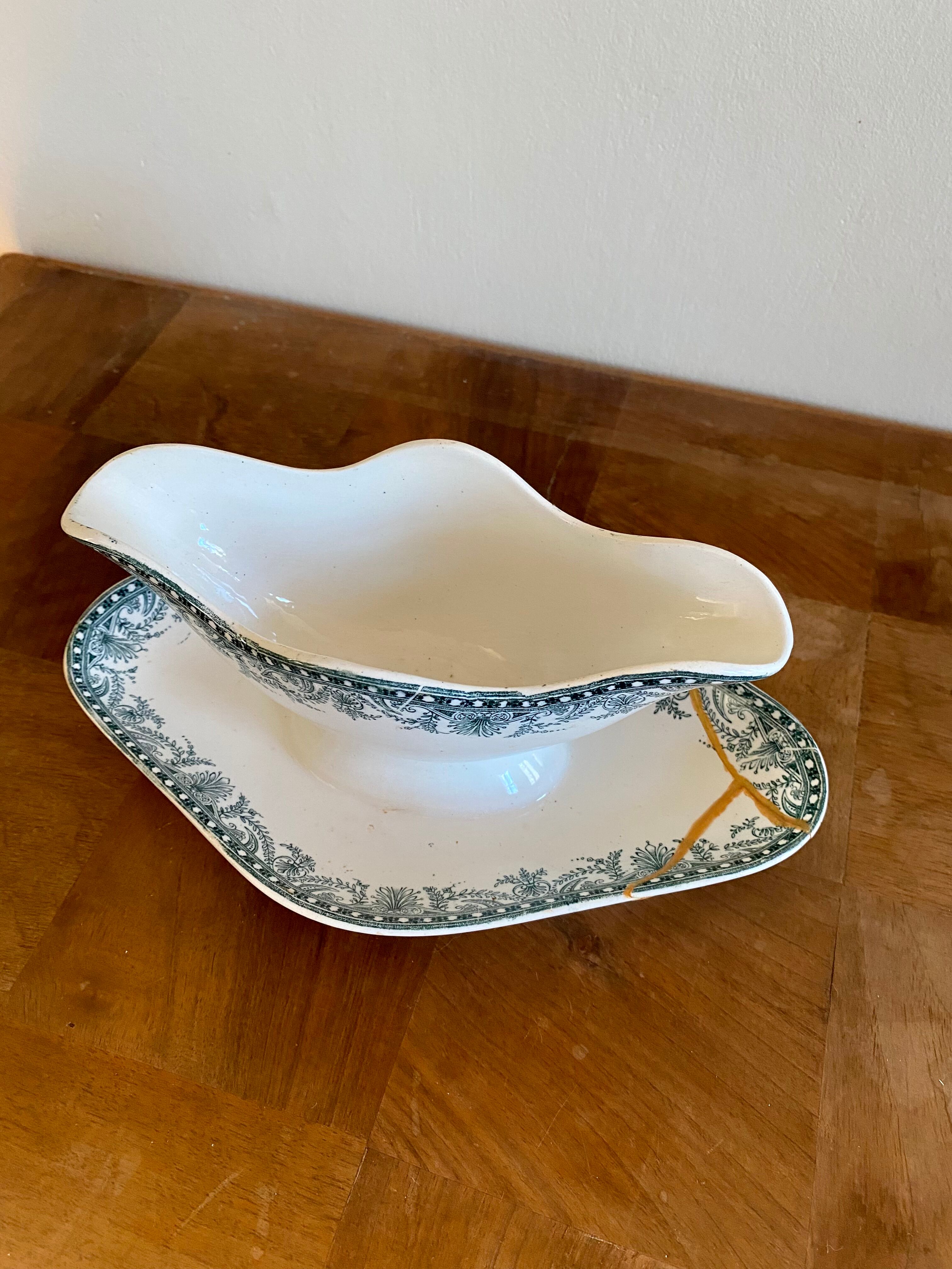 Old gravy boat repaired with the Japanese kintsugi technique