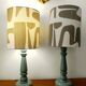 Pair of wooden lamps with custom modernist lampshades.