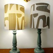 Pair of wooden lamps with custom modernist lampshades.
