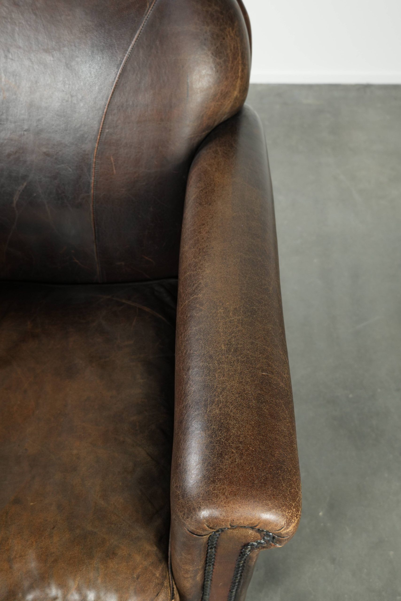 Characterful sheepskin design armchair with beautiful patina