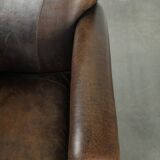 Characterful sheepskin design armchair with beautiful patina