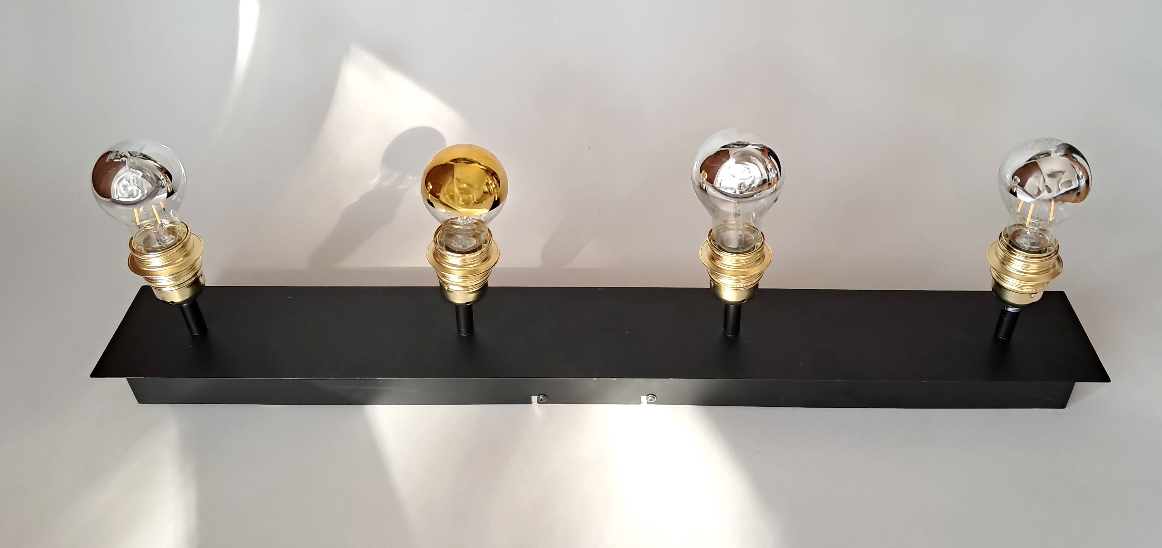 Wall lamp with 4 adjustable lights in black metal and gold-plated brass sockets.
