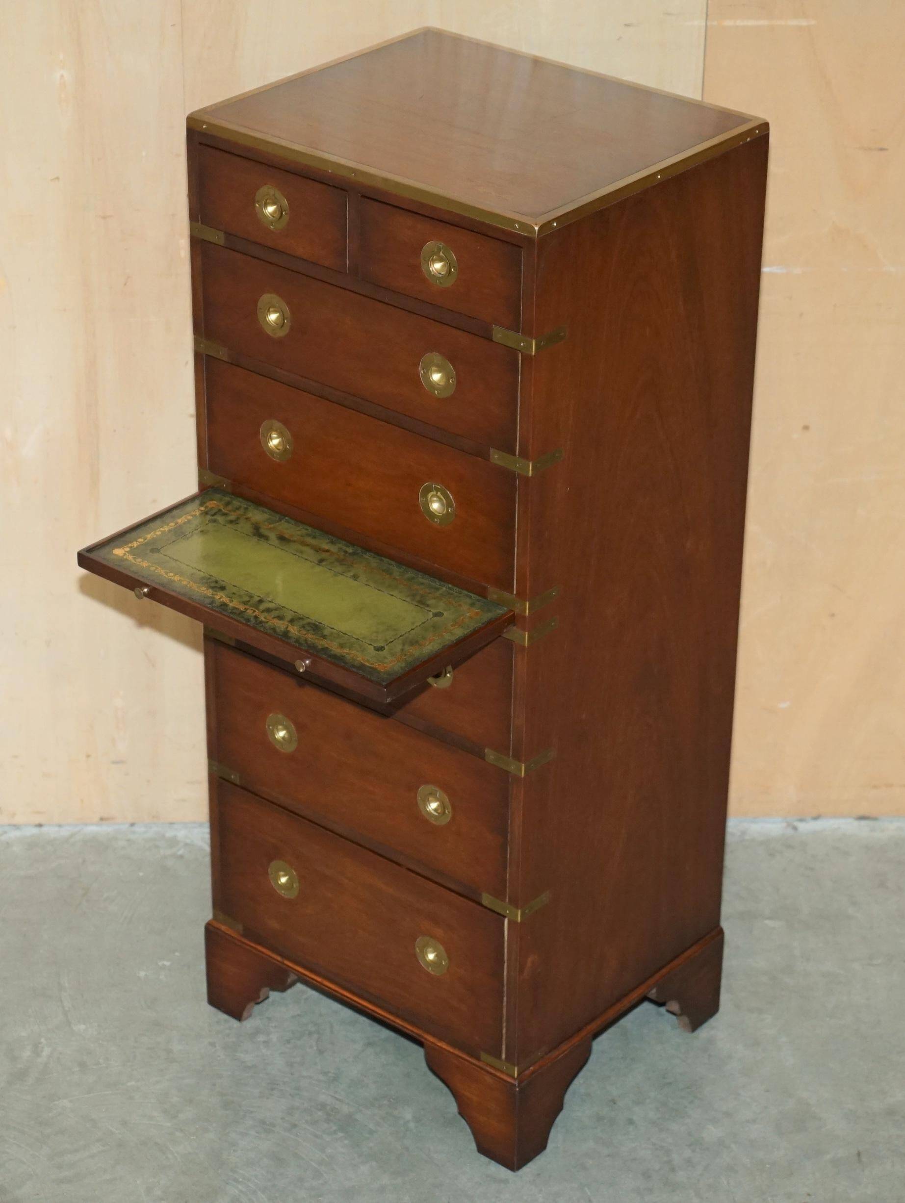 Pair of vintage military campaign high chests of drawers with leather tops.