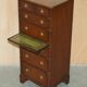 Pair of vintage military campaign high chests of drawers with leather tops.