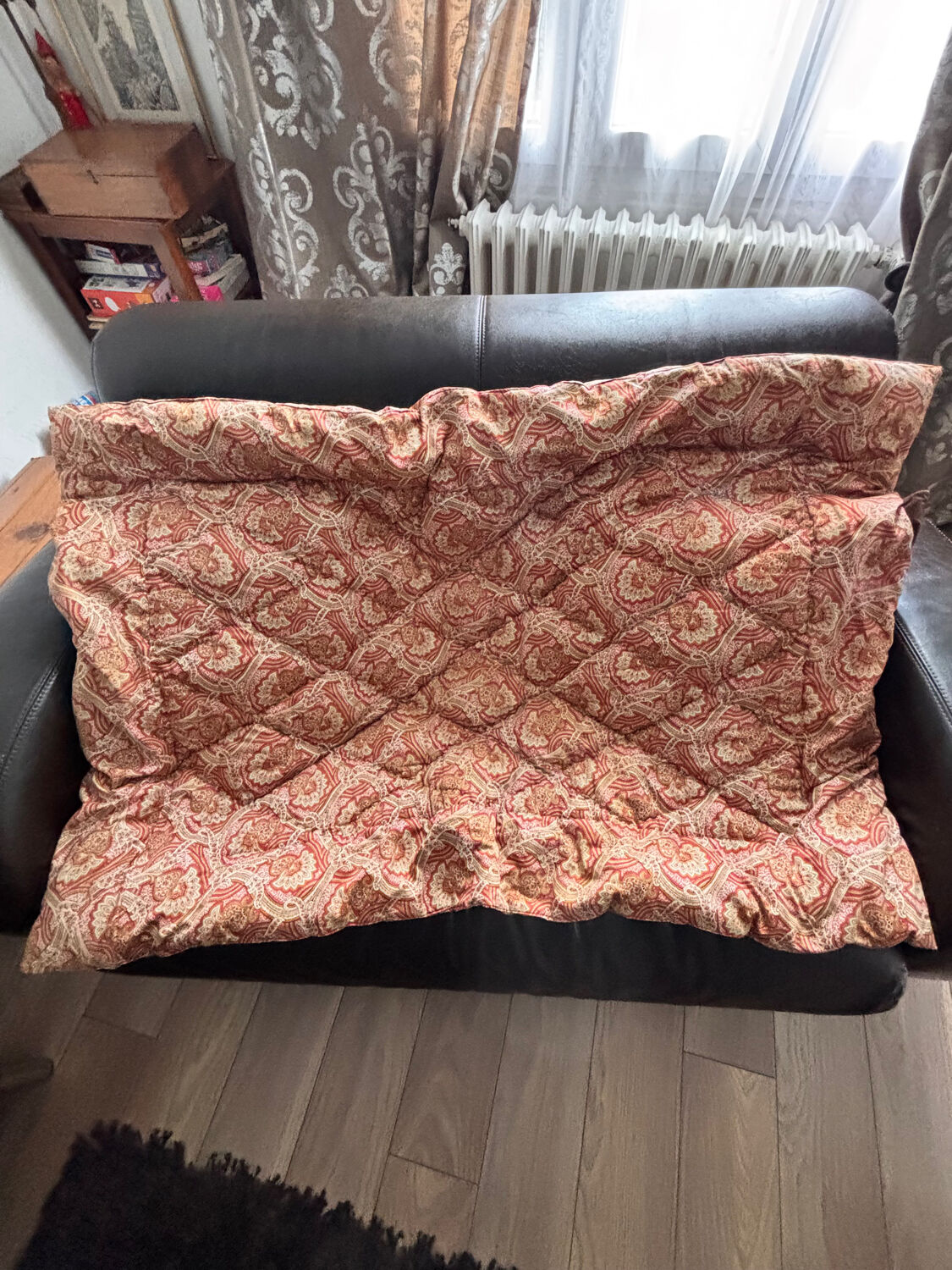 Vintage duvet/bedspread with a paisley pattern.