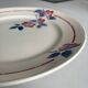 Round plate from the Céranord Saint-Amand service • Red and blue floral decoration