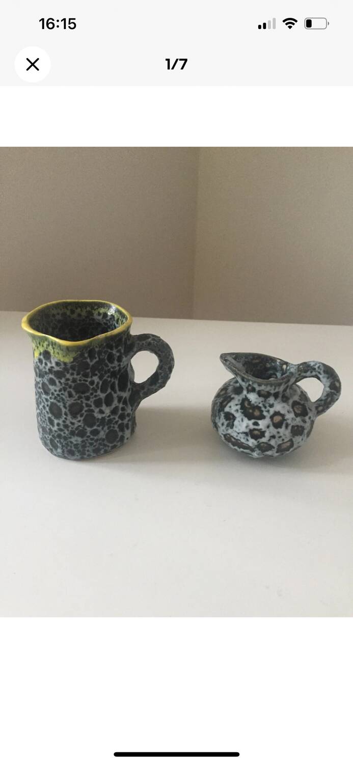 Set of two small Vallauris yellow and black milk jugs