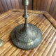 Vintage brass candelabrum engraved with three lights and a snuffer.