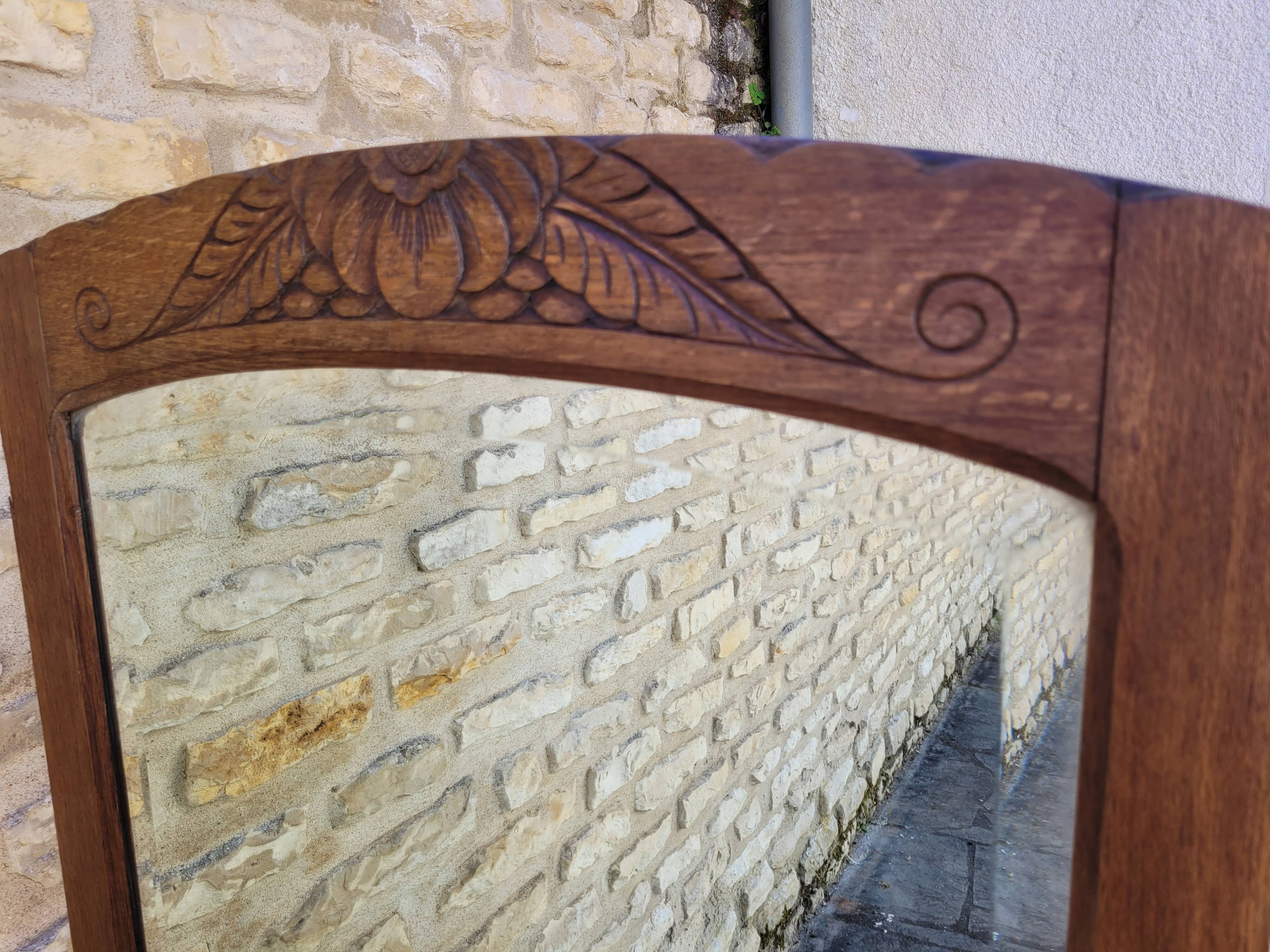 Art Deco oak mirror with bevelled glass from the 1930s.