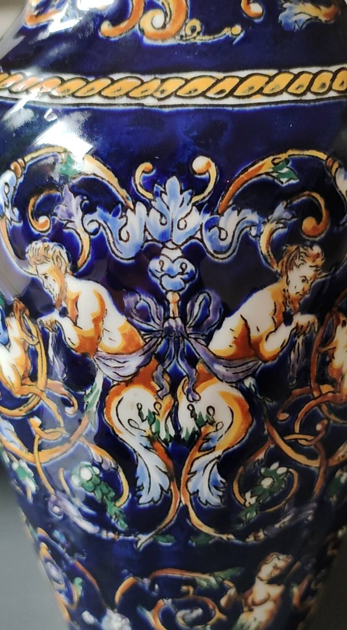 Twisted design vase. Signed Gien France/Renaissance blue background 26 x 13cm