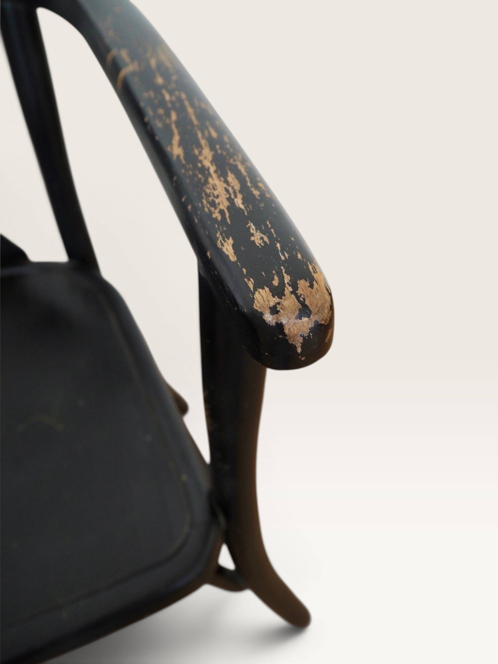 Curved black lacquered wooden armchair in Thonet style