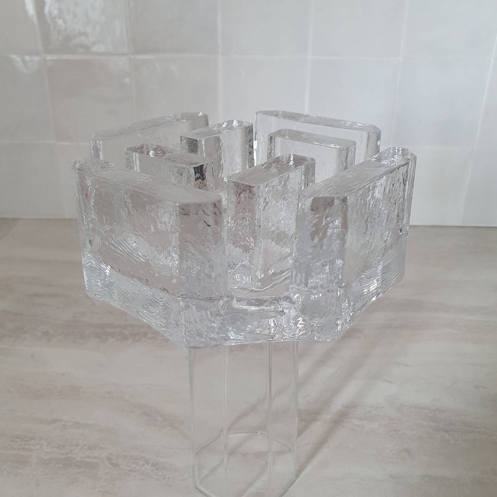 Candle holder or glass warmer with irregular ice effect.