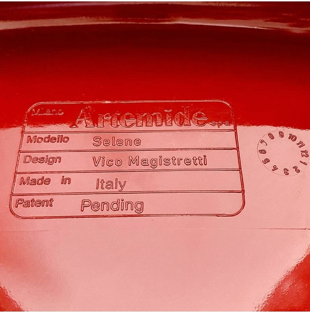 Red chair "selene" by vico magistretti for artemide of the 60s
