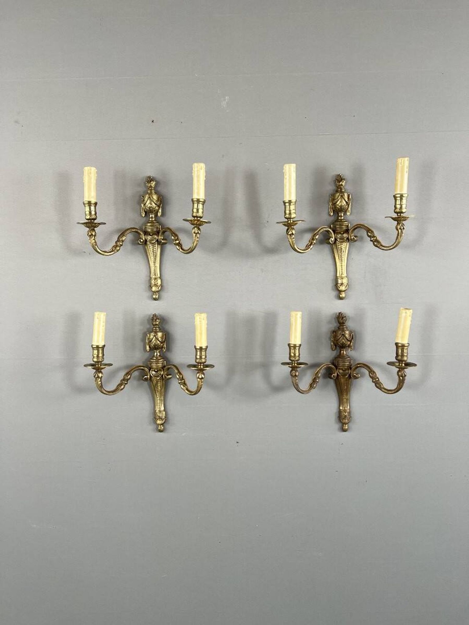 Set of four bronze wall sconces, Louis XVI style, 20th century.