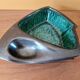 Ceramic ashtray with green and black glaze forming a pipe holder