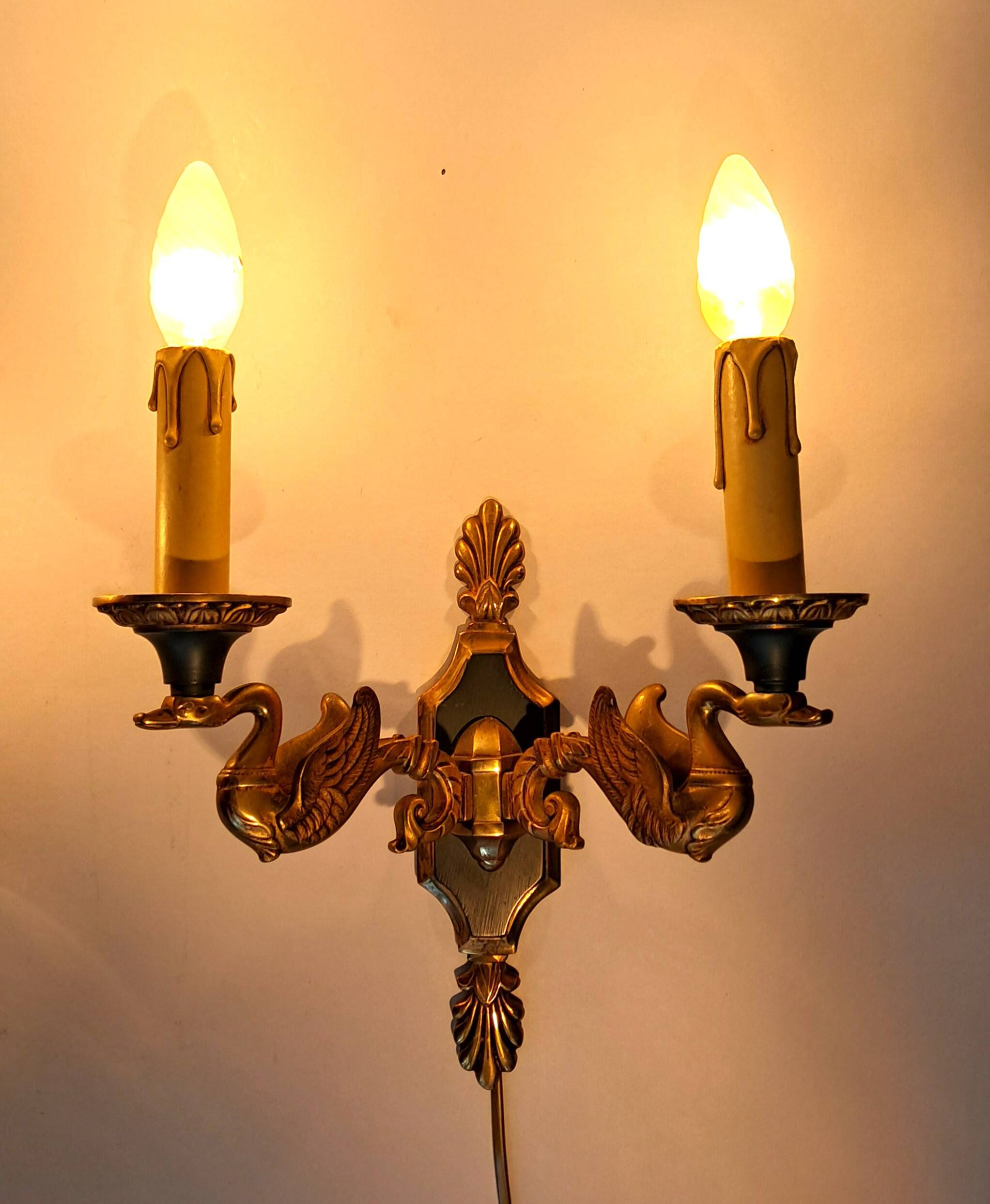 Pair of gilded bronze and green lacquer wall sconces by Maison Lucien Gau, Paris.