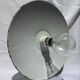 Antique wall lamp with an enamelled metal shade and porcelain.