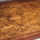 Superb Napoleon III table. Marquetry top and gilded bronzes.