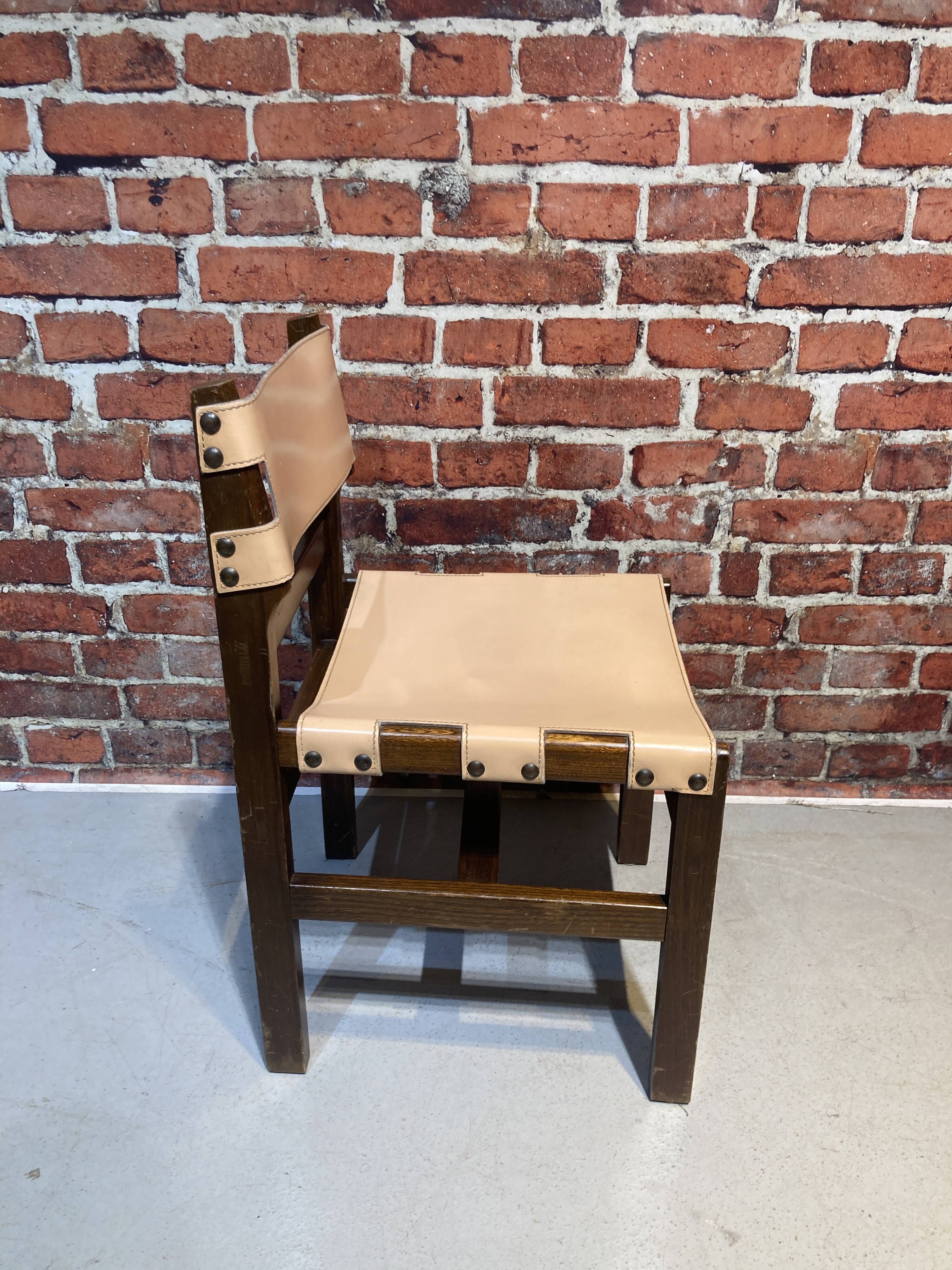 Set of four wooden and leather chairs from Maison Regain