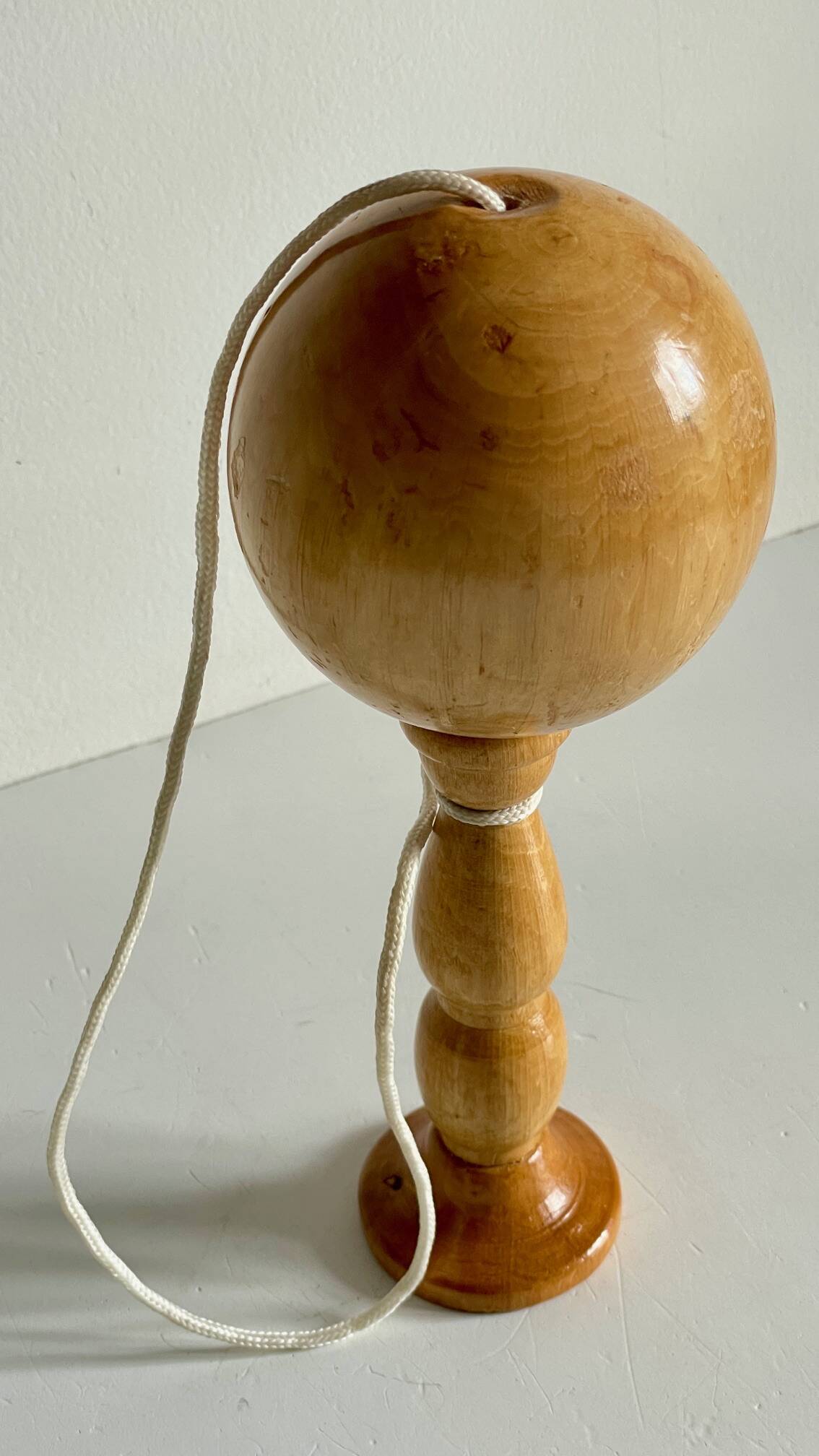 Vintage wooden cup-and-ball toy