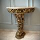 Carved wooden and marble console