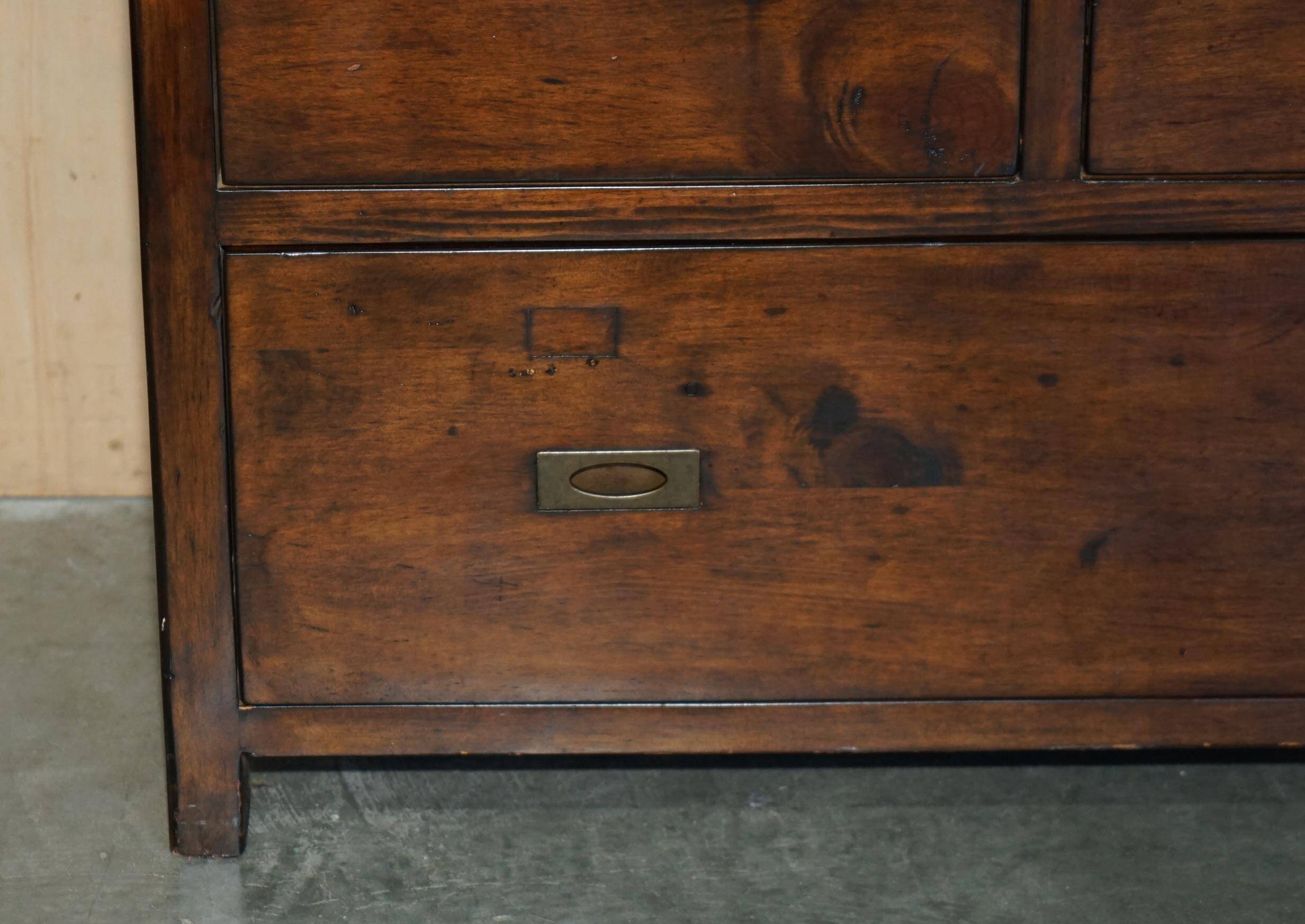 Large vintage hardwood furniture in military country style.