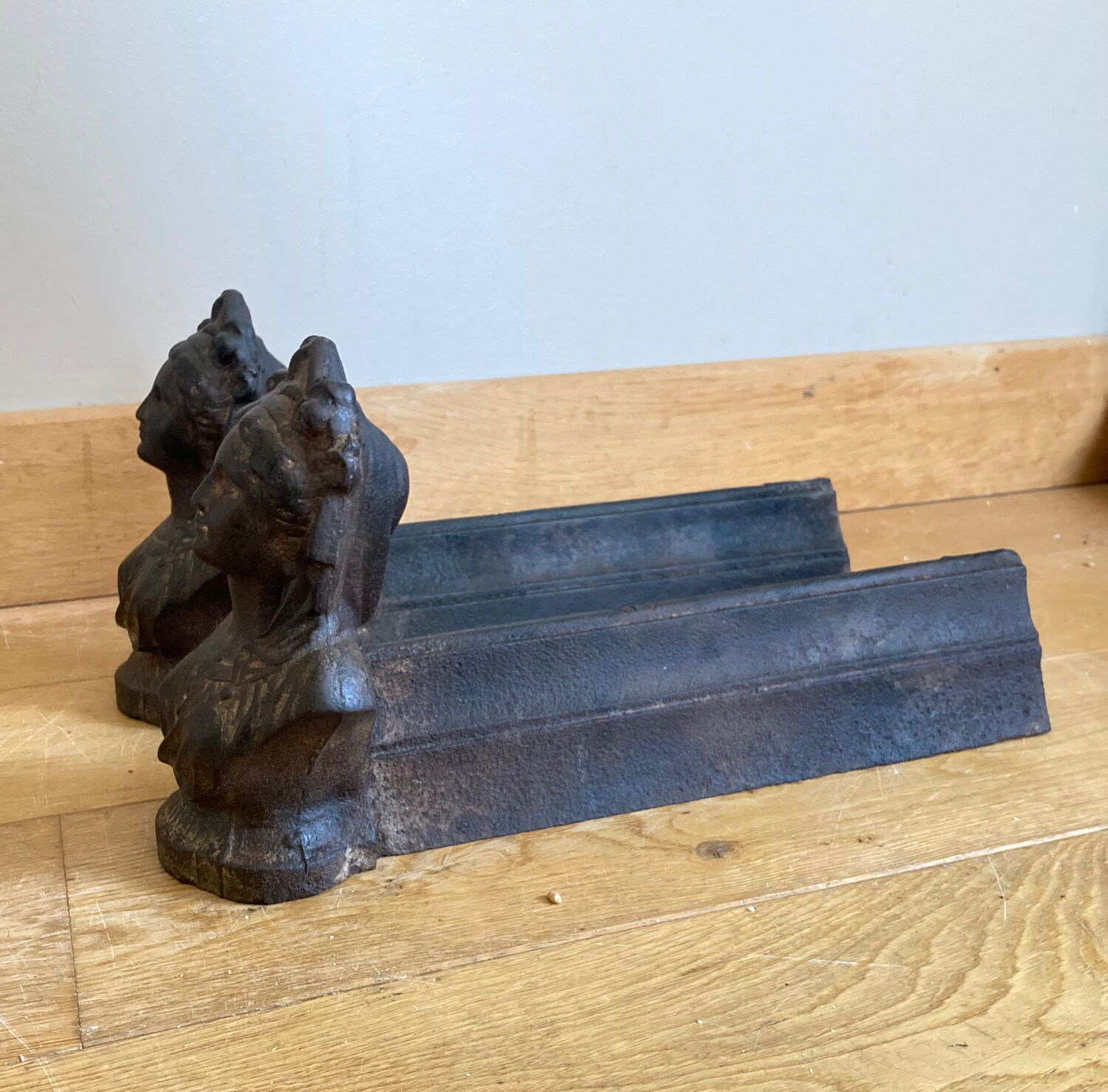 Pair of cast iron andirons from the 19th century, busts of women