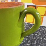 Small two-tone green glazed terracotta jug, height 12 cm.