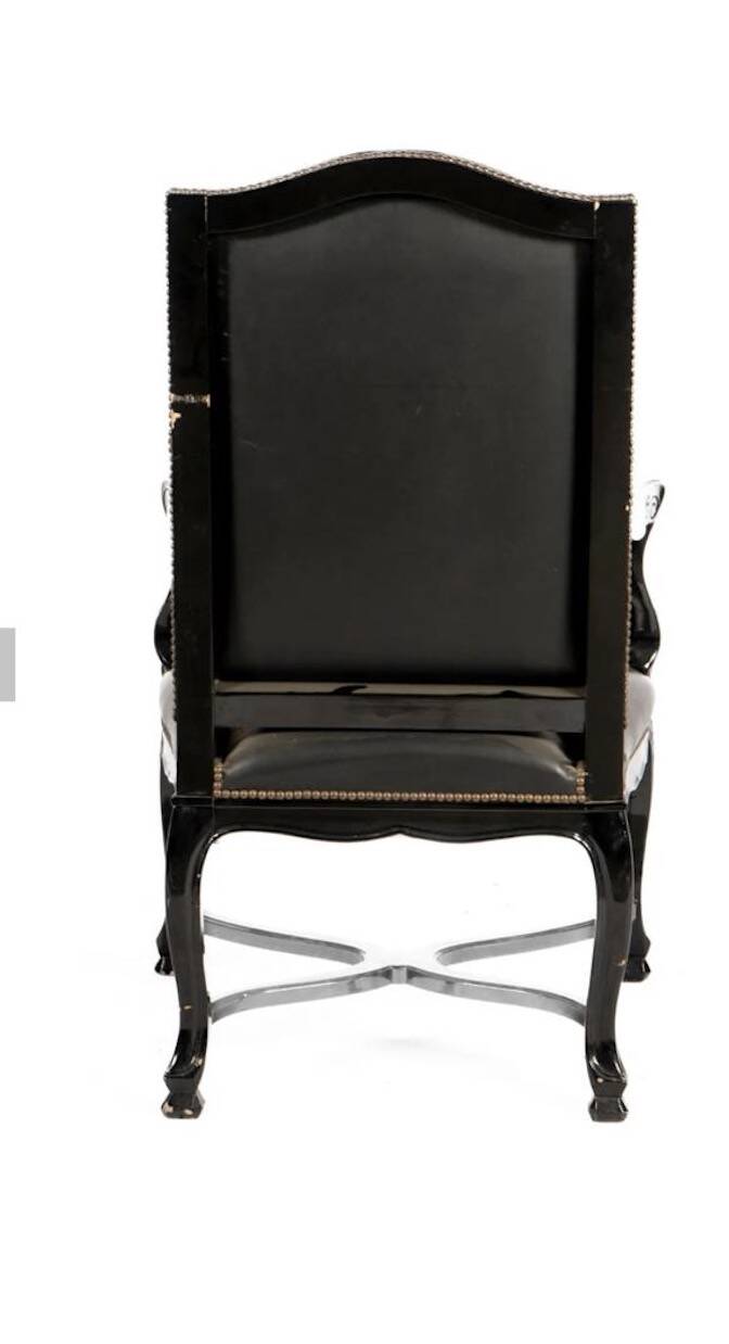 Lacquered and carved moulded wooden armchair