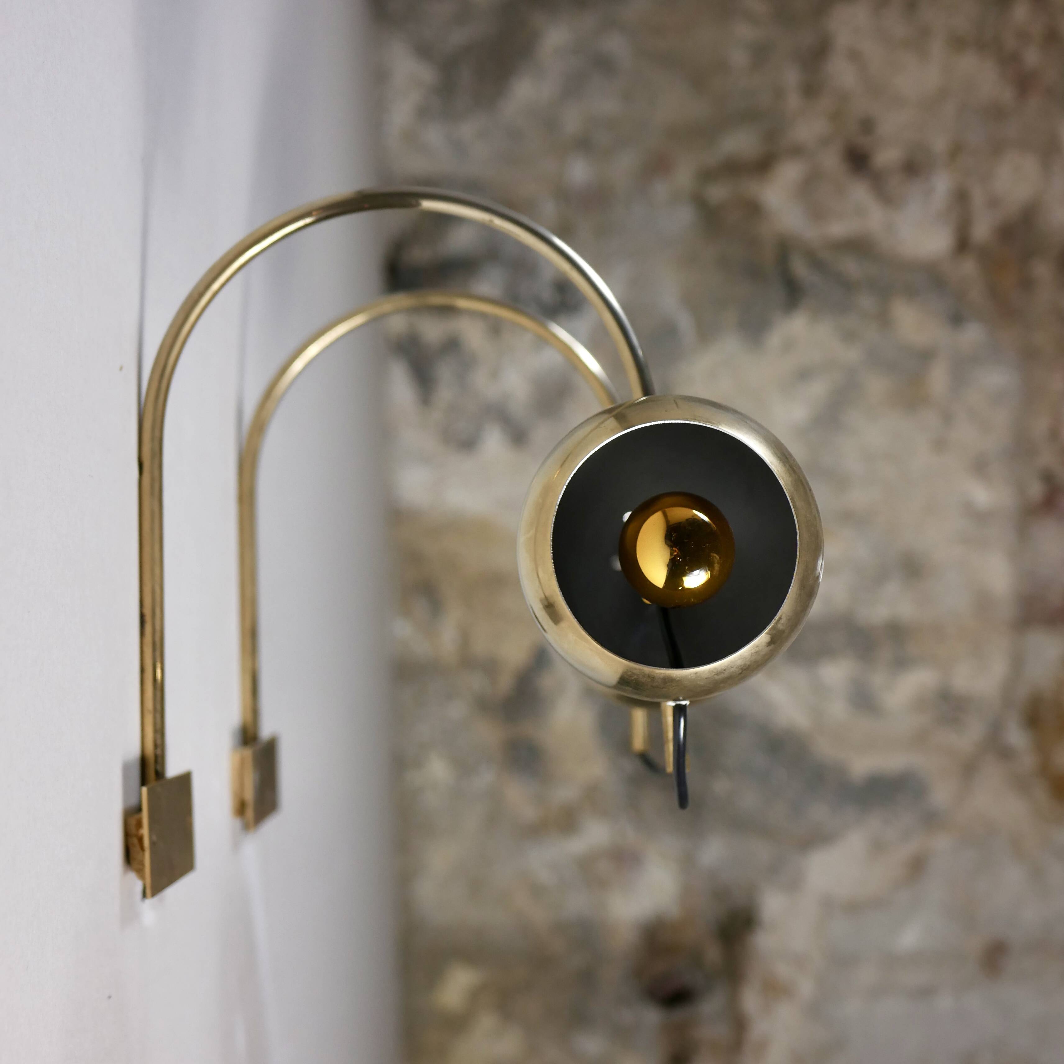 Pair of brass eyeball wall lights