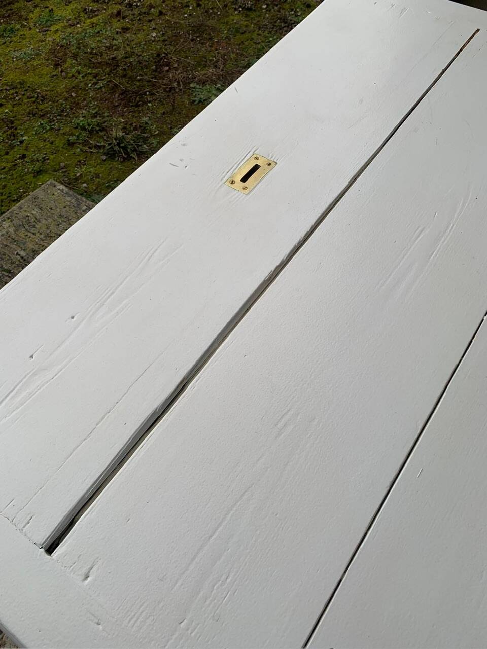 White counter with brass coin mechanism