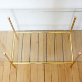 Glass coffee table with magazines holder