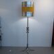 Floor lamp with a large orange shade and metal from the 1960s.